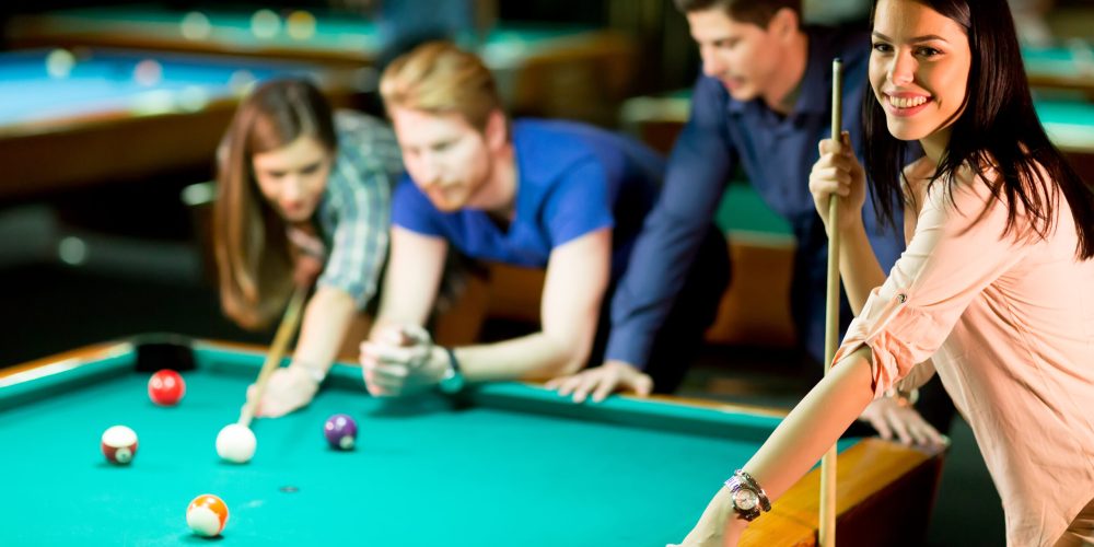 Young people playing pool
